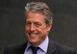 FILE PHOTO: Hugh Grant walks outside the High Court, in London
