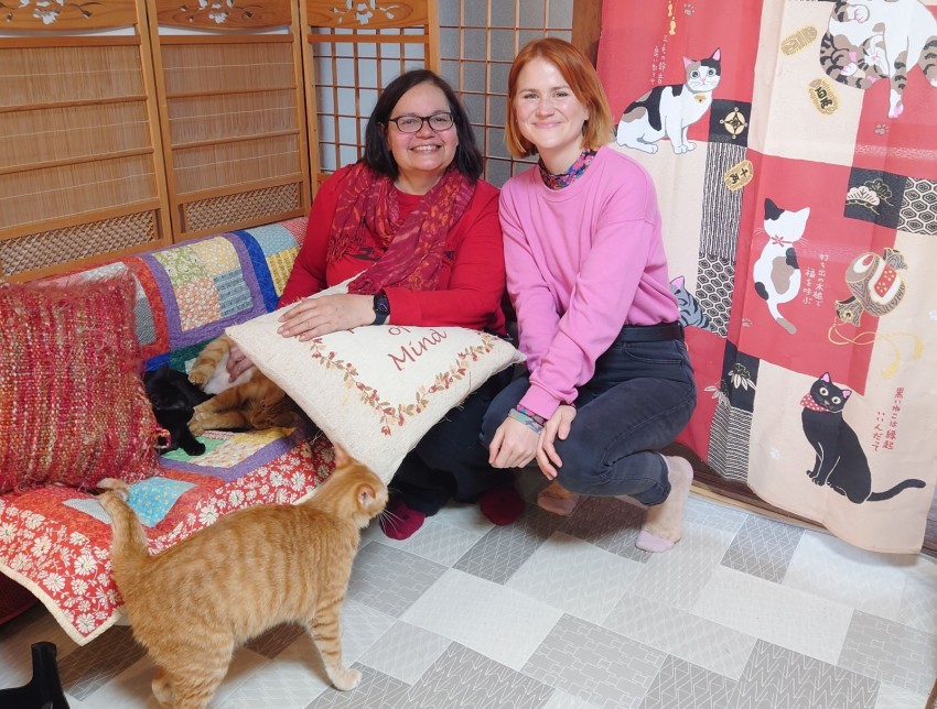 Japan Cat Network (JCN) founder Susan Roberts (left) with a visitor to the NPO's Kyoto shelter.